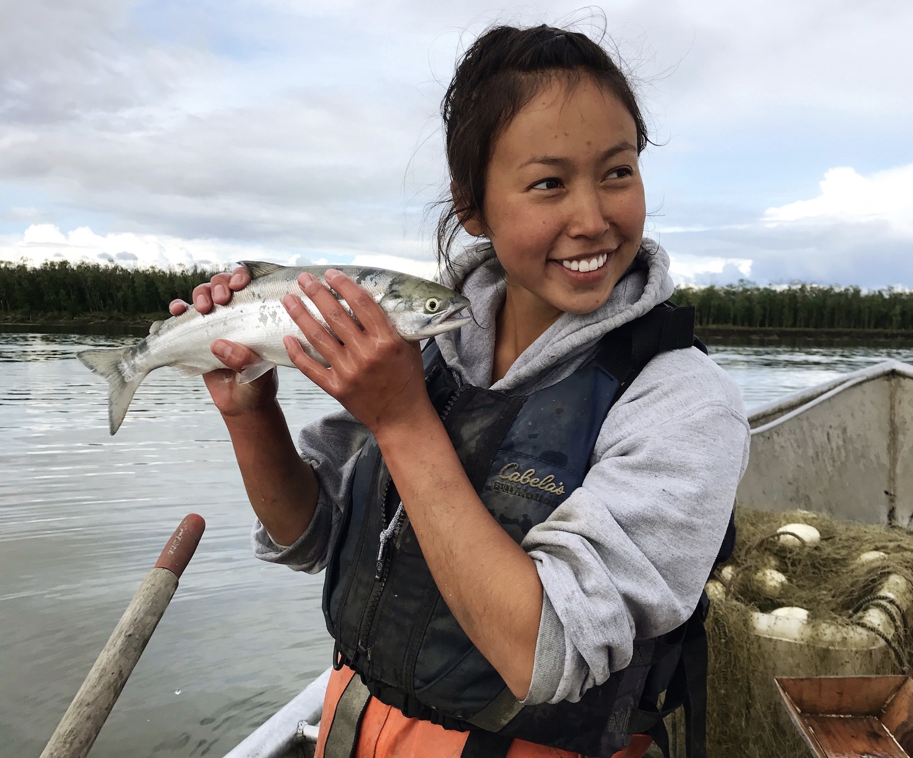 woman holding a fish