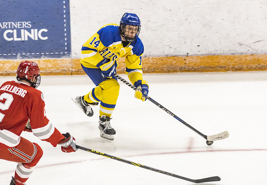 Alaska Nanooks men's hockey forward Anton Rubtsov, passes the puck past Rensselaer Polytechnic Institute Friday, Dec. 10, 2021, at the Carlson Center in Fairbanks. UAF photo by JR Ancheta.