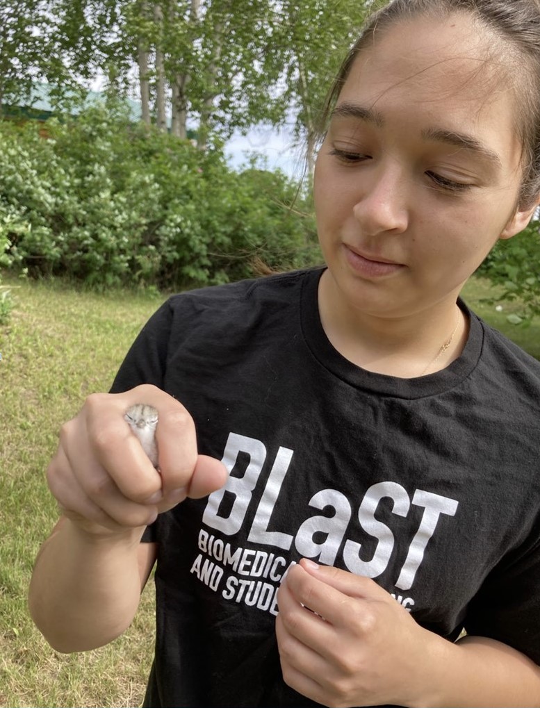 BLaST Scholar Tirzah Bryant holds a Yellowlegs chick.