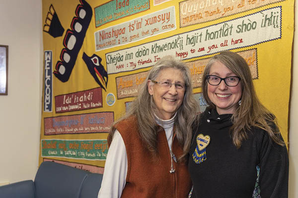 Sue McHenry, left, and Gabby Russell pose for a photograph in the Brooks Building on the Troth Yeddha’ Campus at UAF in December 2022. Russell was honored with the 2021-22 McHenry/Martin Staff Advisor Award, named partly after McHenry. UAF photo by Eric Engman