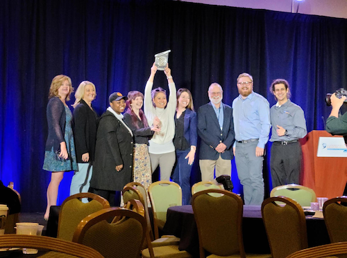 UAF Solar Decathlon team holds up their trophy at the 2022 competition in the National Renewable Energy Laboratory. 