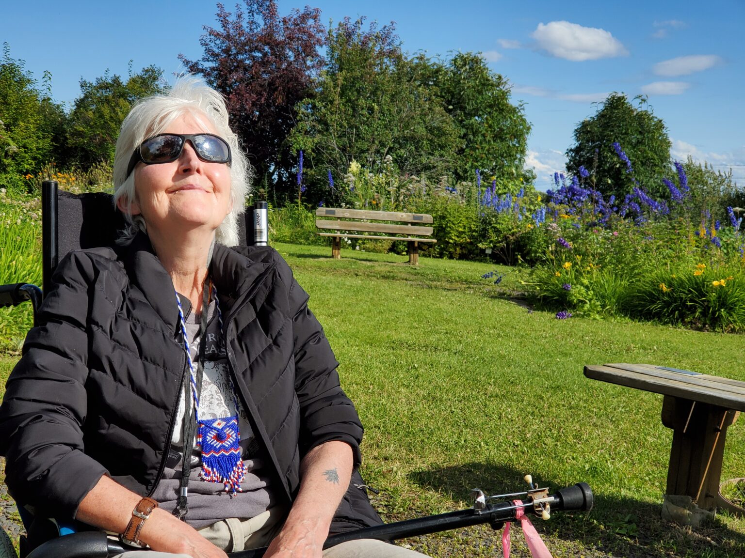 Jenny Bell Jones enjoying the sunshine at the UAF Georgeson Botanical Garden in July 2020. Photo provided by Jennifer Carroll. 