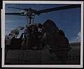 Thumbnail for File:98th Transport Detachment crewman checks the electrical system of a downed UH-1.jpg