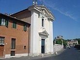 A two story building with a classical pediment and pillars