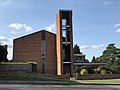 St Michael and All Saints Roman Catholic Church, built 1961-4 by Henry Bingham Towner and officially opened by Archbishop Cyril Cowderoy[4]