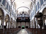 Vue de la nef vers la tribune et l'orgue Rohrer-Roethinger (1914).