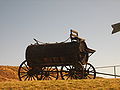 A cart for transporting water from a well powered by a windmill