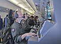 Airmen aboard a US Navy P-8A Poseidon aircraft monitor their workstations while searching the southern Indian Ocean/Askar udara pesawat Tentera Laut Amerika Syarikat P-8A Poiseidon memantau stesen kerja mereka ketika mencari di Laut India selatan/美国海军飞行员驾驶着P-8A“海神”，监视着屏幕用以搜索南印度洋