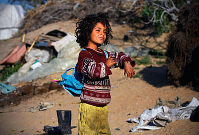 Sabha, 6, getting ready to walk to school from her house on the borders eastern Gaza strip, where she and her family are still living in tents.