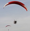 Kite anchored to moving power-kite operator