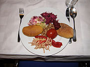 Pirozhki, pickled tomato, mixed salads