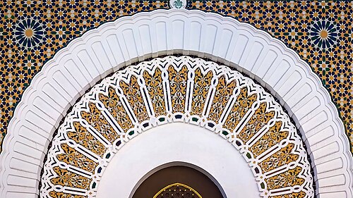 The entrance door of the Mederessa (school) of Tlemcen embellished with the Islamic decorative Zellij.