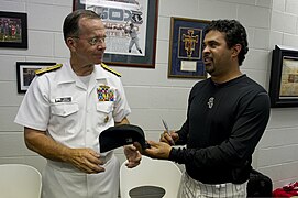 Chairman of the Joint Chiefs of Staff Navy Adm. Mike Mullen, left, talks to a Chicago White Sox player during his visit to Chicago Aug. 25, 2010 100825-N-TT977-453.jpg