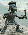 Image 73Statue of Minnie the Minx, a character from The Beano, in Dundee, Scotland. Launched in 1938, The Beano is known for its anarchic humour, with Dennis the Menace appearing on the cover. (from Culture of the United Kingdom)