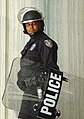 A Police officer with a riot shield