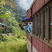 Sabah State Railway Train-Attendant-giving-clearance-signal-01.jpg