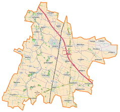 Mapa konturowa gminy Żórawina, u góry nieco na lewo znajduje się punkt z opisem „Karwiany”