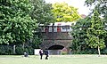 Piccadilly Line train (1973 Stock) visible from the park, 2015