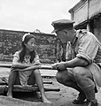 Image 2A liberated Chinese girl who had been forced in to sexual slavery by the Japanese military sits on a stretcher and speaks to a British military serviceman. (from Prostitution)
