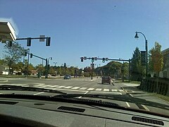 A traffic light in Westbrook, Maine. Notice the red arrow to the left of the two green straight lights.