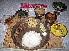 Assamese style thali served in a restaurant.