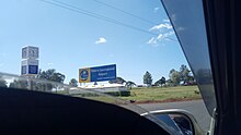 A view of the sign to Eldoret International Airport near the gate to the airport.