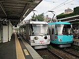 西太子堂駅停車中の310Fと「玉電110周年幸運の招き猫」電車308F（2019年6月1日）