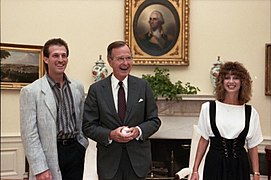 President George H. W. Bush meets with Nick Esasky and his wife in the Oval Office, and they exchange signed baseballs (02).jpg