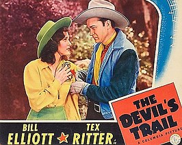 Eileen O'Hearn[1] en Tex Ritter (?) Bill Elliott (?) in The devil's trail uit 1942