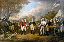 A color painting. In the center is the white-haired Horatio Gates, facing front, wearing a blue military jacket, yellow pants, and knee-length dark boots. His right hand is reaching out to accept the sword of John Burgoyne, who faces to the right, and wears a red coat and white pants. Behind and to his left is another similarly attired officer. Behind him, and to the left of Gates, are Continental Army soldiers wearing a variety of different uniforms; those on the right of the painting are standing behind a brass cannon, and to the far left is a blue-coated man on a gray horse. The background on the left is countryside with hills visible in the distance, and a partly cloudy sky. The background on the right includes a white tent, above which waves a flag similar to the United States flag, although it has a smaller number of stars on the blue field, arranged in a square.