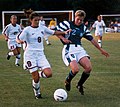 Image 12Mia Hamm (left) battles with German defender Kerstin Stegemann (from Women's association football)