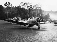 Dive bombing aircraft taxi along a makeshift airstrip