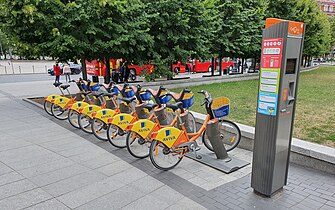 A line of rental bicycles and a vending machine