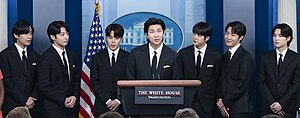 BTS at the White House in May 2022 (left to right): V, Jungkook, Jimin, RM, Jin, J-Hope, and Suga