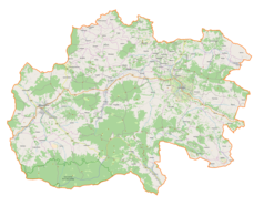 Mapa konturowa powiatu limanowskiego, po lewej znajduje się punkt z opisem „Mszana Dolna”