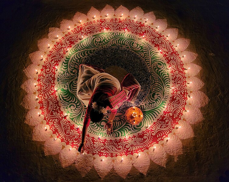 File:Woman lighting the candles for the Festival of Lights in India (cropped).jpg