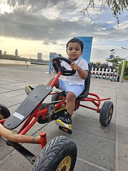 File:Child enjoying in the park.jpg