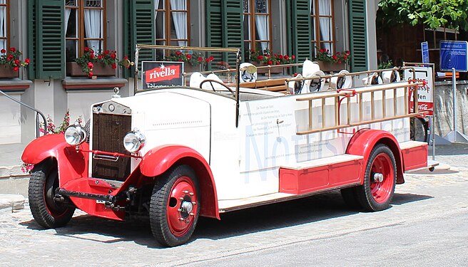 Old Fiat Fire Engine parked in front of an Inn in Central Switzerland