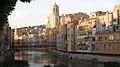 The cathedral with the Eiffel Bridge over the Onyar River in the foreground