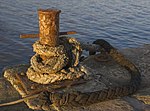 Thumbnail for File:Mooring bollard at sunset, Lyme Regis.jpg