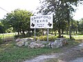 Welcome sign into Crawford on FM 185.