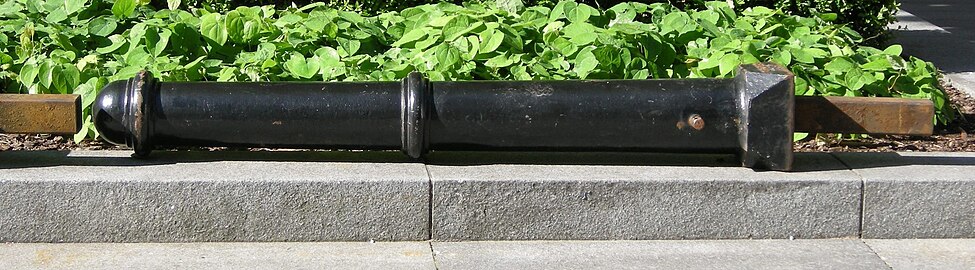 A removable metal bollard out of its socket in London