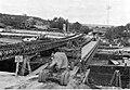 Barges being used to support Bailey bridging over the Seine at Mantes, France, August 1944