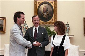 President George H. W. Bush meets with Nick Esasky and his wife in the Oval Office, and they exchange signed baseballs (01).jpg