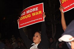 Holding up signs at an anti-war on drugs protest in Los Angeles, 2011.