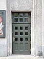 Door on Warszawska Street, with a tiny statue of Krystyna Bochenek