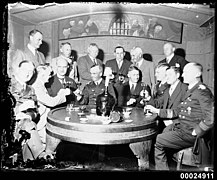 German naval officers and officials drinking at a table, 1933.jpg