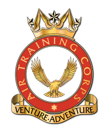 A heraldic badge of the Air Training Corps. Its motto, 'Venture Adventure' is contained in a stylised scroll at the foot of the badge.