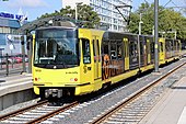 Renovierter Wagen in der Farbgebung des ÖPNVs von Utrecht, Kanariengelb mit einem grauen Balken in der Mitte des Wagens