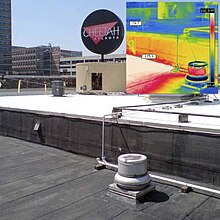 Infrared image shows excellent heat reflective properties of elastomeric roof coatings.